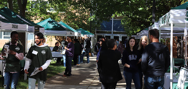 Students interacting with booths on Preview Day